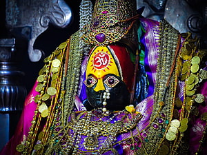 Ornate Tulja Bhavani Murti Adorned in Gold Jewelry and Purple Silk HD wallpaper