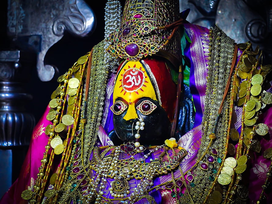 Ornate Tulja Bhavani Murti Adorned in Gold Jewelry and Purple Silk HD wallpaper