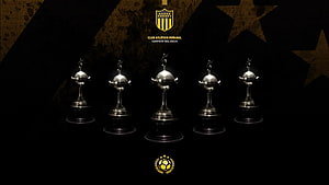 Club Atlético Peñarol Trophy Collection and Championship Crest on Dark Background HD wallpaper