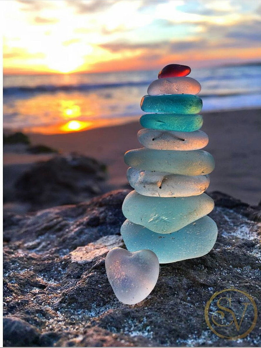 Sea Glass Stone Stacking on Rocky Shore at Sunset HD phone wallpaper