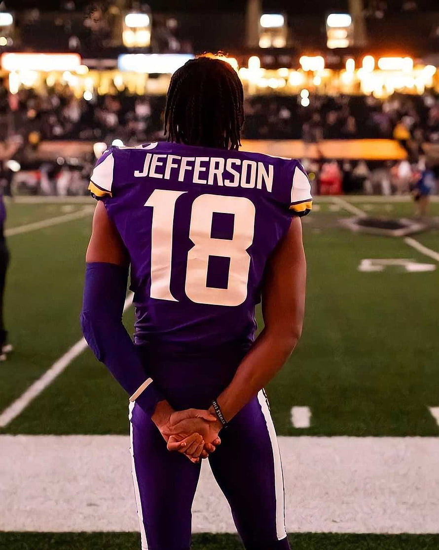 Justin Jefferson in Minnesota Vikings Purple Jersey Standing on the Football Field HD phone wallpaper