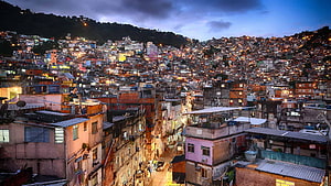 Dense Favela Settlement on Rio de Janeiro Hillside at Dusk HD wallpaper