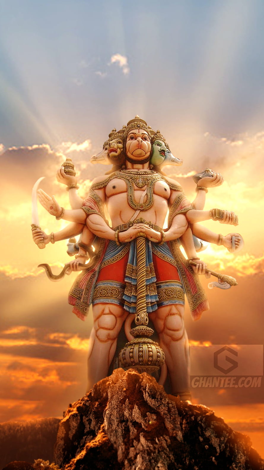 Sri Hanuman Multi-Armed Divine Form Standing on Rock at Sunset HD phone wallpaper