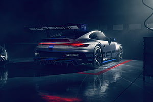 Porsche 911 GT3 Cup 992 Rear View in Dark Garage with Red Taillights and Blue Accents HD wallpaper