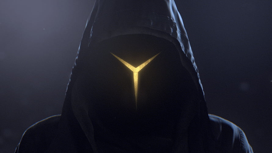 Mysterious Hooded Figure with Glowing Golden Symbol in Dark Atmosphere HD wallpaper