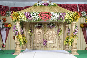 Traditional Indian Wedding Stage Decorated With Floral Canopy And Gold Pillars HD wallpaper