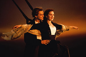 Jack and Rose Embracing on the Bow of the Titanic at Sunset HD wallpaper