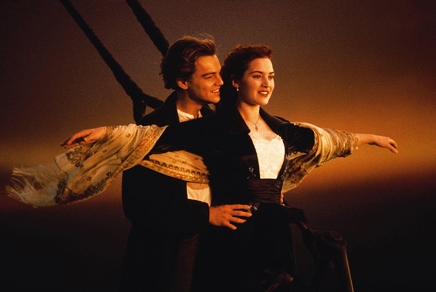 Jack and Rose Embracing on the Bow of the Titanic at Sunset HD wallpaper