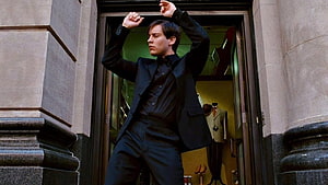 Tobey Maguire as Peter Parker in a dramatic black suit pose from Spider-Man HD wallpaper