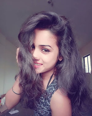 Young Woman With Long Wavy Hair Smiling In A Casual Indoor Portrait, 70 Cute Girl DP For Whatsapp, #cute girl dp HD phone wallpaper