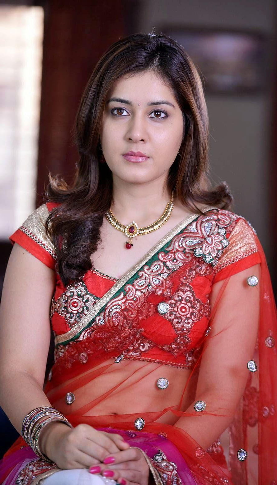 Rashi Khanna in a red embroidered sari with gold jewelry and bangles HD phone wallpaper
