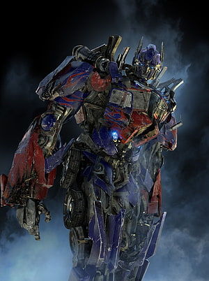 Optimus Prime from Transformers Revenge of the Fallen in battle-worn armor against a dark smoky backdrop HD phone wallpaper