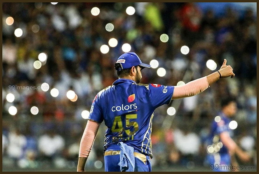 Rohit Sharma in Mumbai Indians jersey pointing to the crowd during an IPL match HD wallpaper