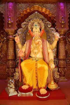 Ornate Ganesha Murti Seated on Golden Throne with Mouse Companion HD phone wallpaper
