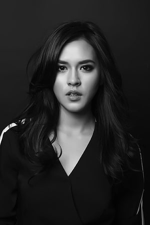 Raisa Andriana Black and White Portrait with Long Wavy Hair and Dark Blazer HD phone wallpaper
