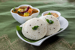 Steamed Idli with Sambar and Chutney on a Green Tablecloth HD wallpaper
