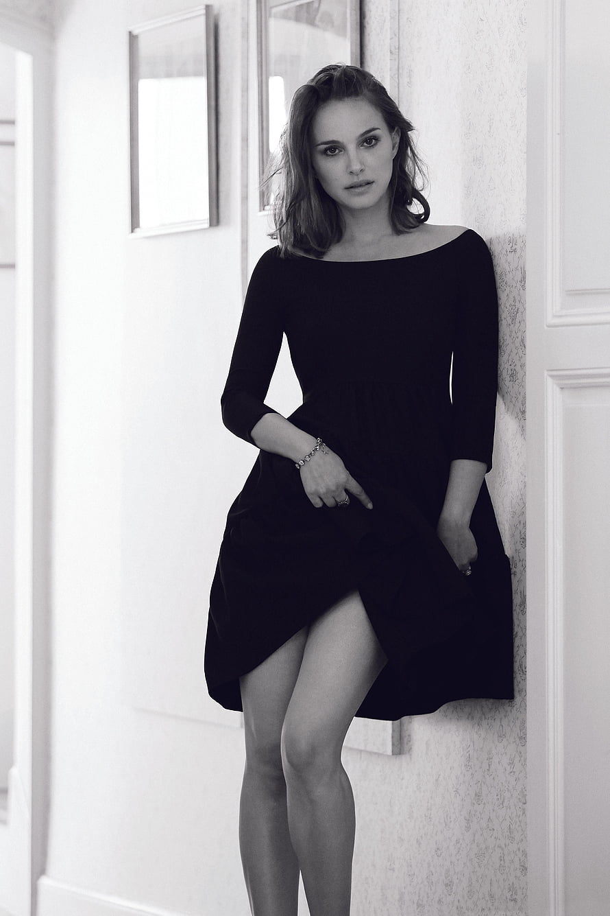 Natalie Portman in Black Off-Shoulder Dress Leaning Against White Wall HD phone wallpaper