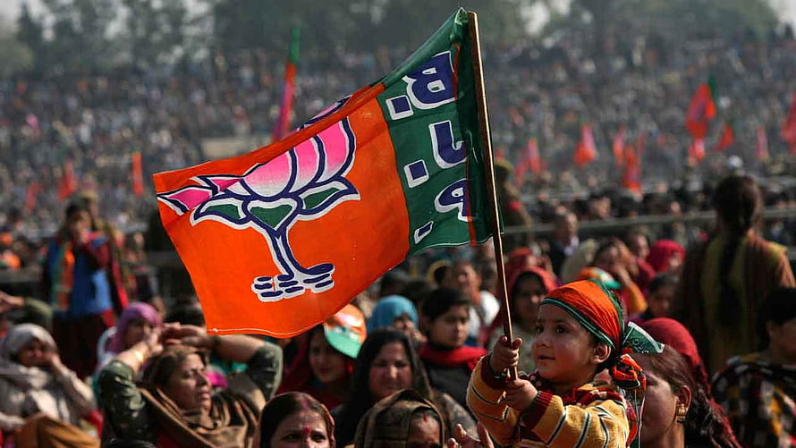 Young Child Holding BJP Lotus Flag at Large Indian Political Rally HD wallpaper