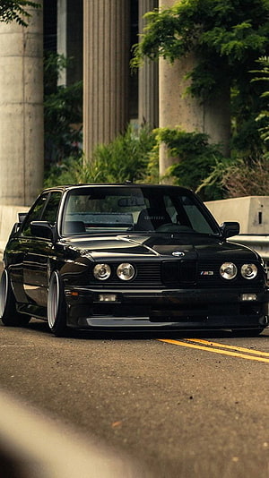 Black BMW E30 M3 Stance Build Parked on Urban Street HD phone wallpaper