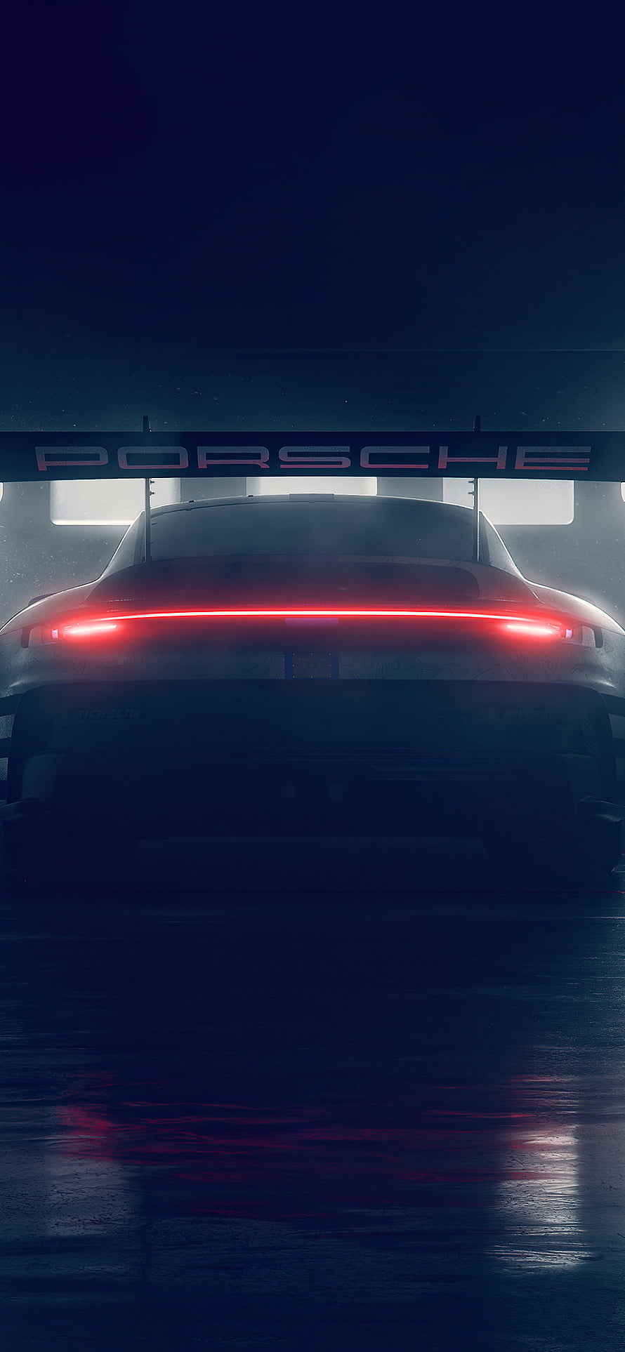 Porsche 911 GT3 Cup 992 Rear View with Glowing Red Light Bar in Dark Garage Setting HD phone wallpaper