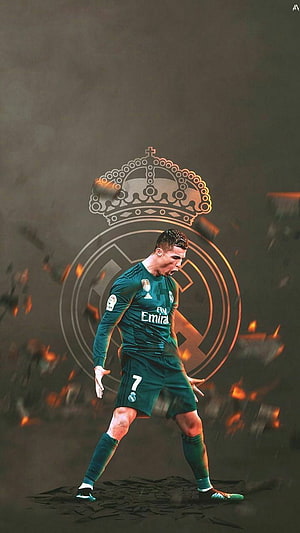Cristiano Ronaldo in Real Madrid Green Kit with Club Crest and Dramatic Fire Effects HD phone wallpaper