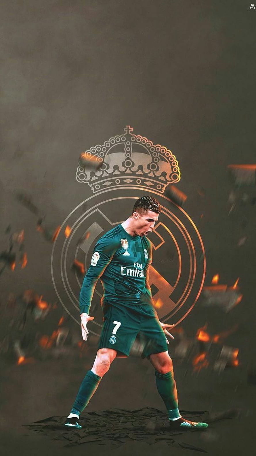 Cristiano Ronaldo in Real Madrid Green Kit with Club Crest and Dramatic Fire Effects HD phone wallpaper