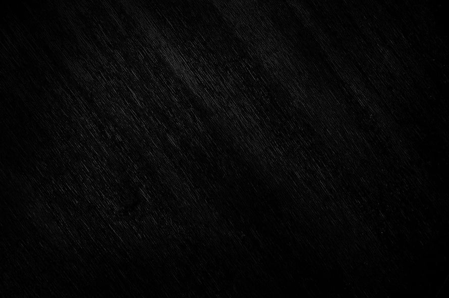 Dark Textured Black Surface with Subtle Diagonal Grain Pattern HD wallpaper