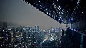Moody Nighttime Cityscape View From a High-Rise Rooftop Balcony HD wallpaper