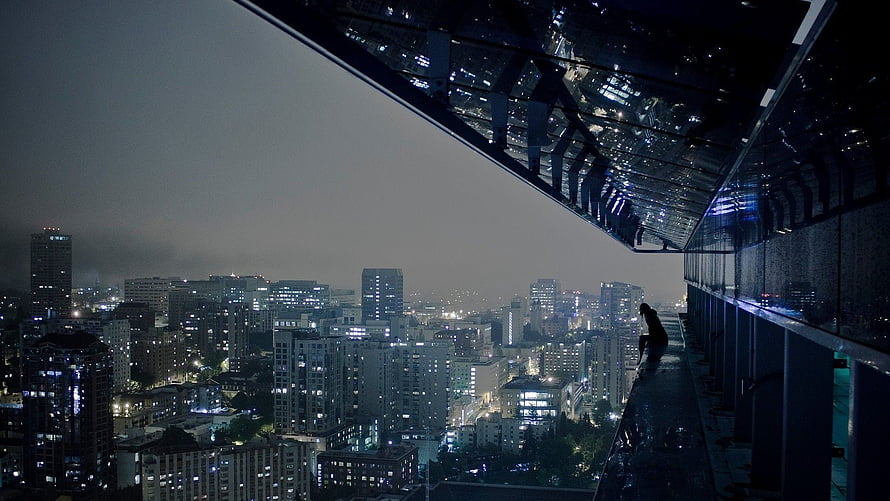 Moody Nighttime Cityscape View From a High-Rise Rooftop Balcony HD wallpaper