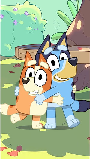 Bluey and Bingo sharing a warm hug in a colorful garden setting from the animated series HD phone wallpaper