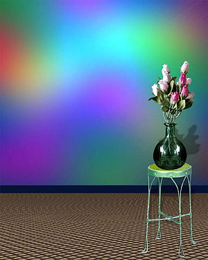 Pink roses in a green glass vase on a wire stand against a vibrant rainbow gradient studio backdrop HD phone wallpaper