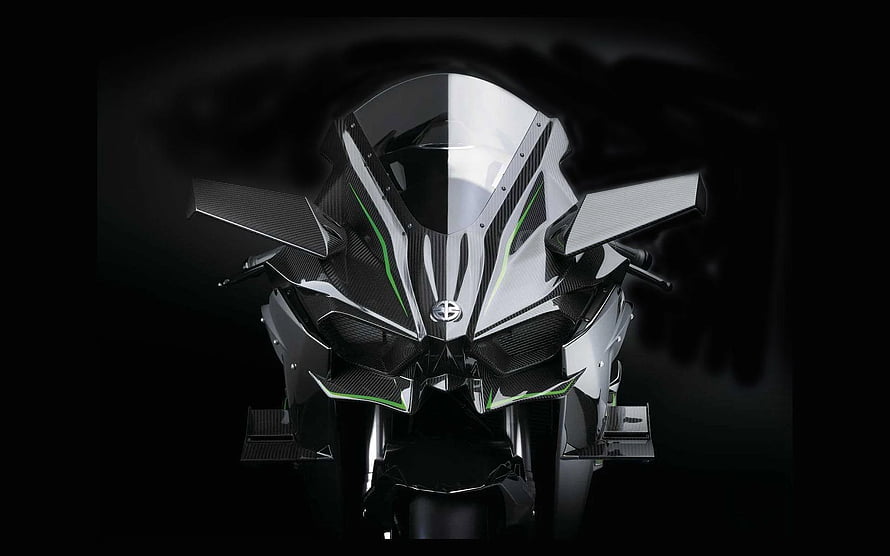 Aggressive Carbon Fiber Motorcycle Front View with Green Accents and Dark Studio Lighting HD wallpaper