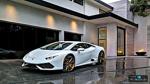 White Lamborghini Huracan Parked in Front of Modern Luxury Villa HD wallpaper
