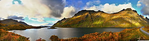 Panoramic Autumn Fjord Landscape with Dramatic Mountain Peaks and Golden Foliage HD wallpaper