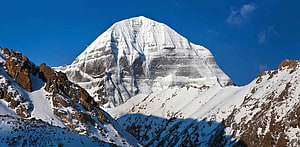 Majestic Snow-Capped Mount Kailash Peak Rising Above Rugged Himalayan Terrain HD wallpaper