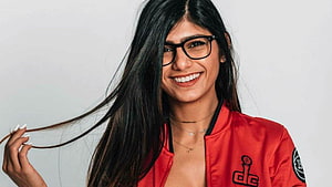 Smiling Woman in Red DC Jacket with Black Glasses and Long Hair, Mia Khalifa HD wallpaper