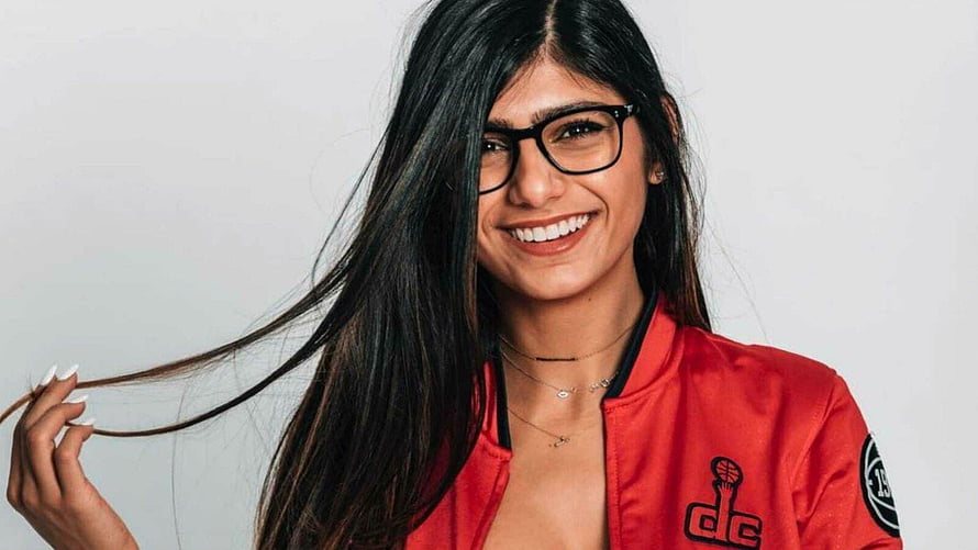 Smiling Woman in Red DC Jacket with Black Glasses and Long Hair, Mia Khalifa HD wallpaper