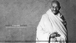 Mahatma Gandhi Portrait in White Dhoti with Round Glasses and Gandhi Jayanti Quote HD wallpaper