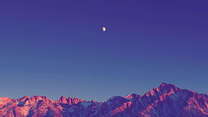 Gibbous Moon Over Snow-Capped Mountain Peaks at Twilight HD wallpaper