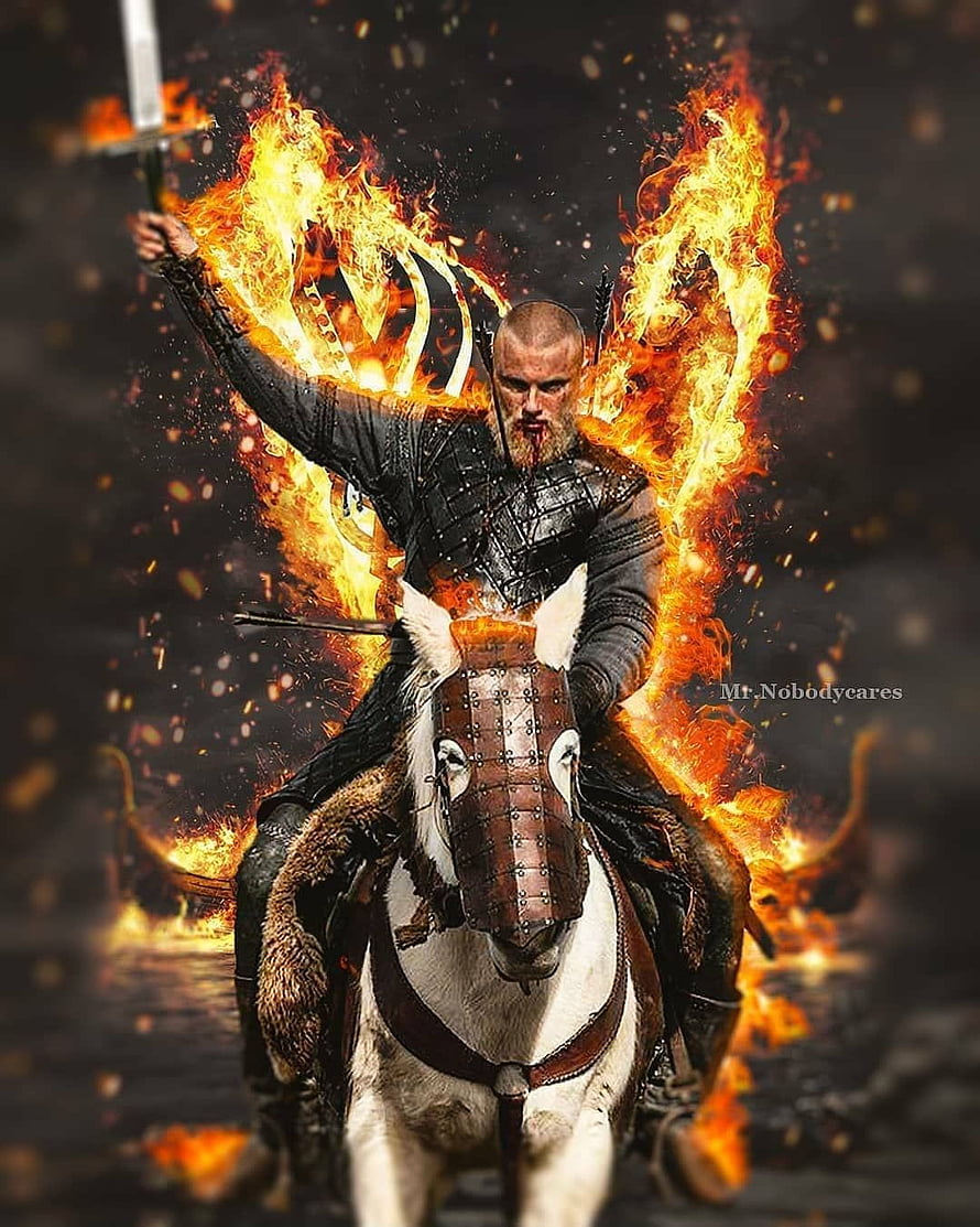 Bjorn Ironside on Horseback with Sword and Flames in Viking Armor HD phone wallpaper