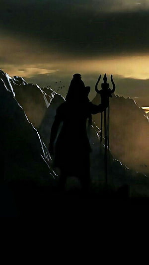Lord Shiva Silhouette Standing on Mountain Peak with Trident at Dusk HD phone wallpaper