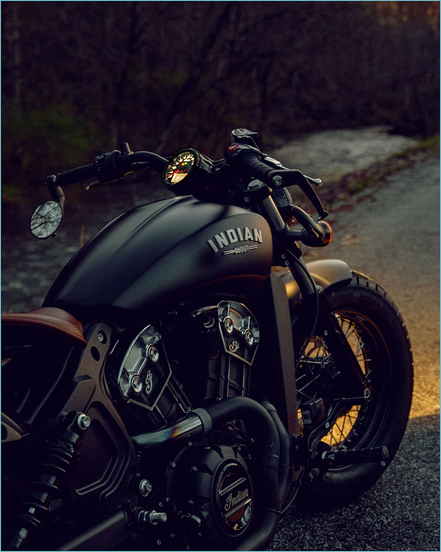 Indian Scout Bobber Matte Black Cruiser Motorcycle on Gravel Road at Dusk HD phone wallpaper