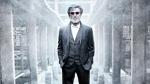 Rajinikanth in Kabali Movie Poster Wearing Grey Suit and Sunglasses in Industrial Setting HD wallpaper