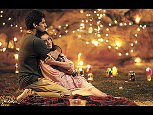 Aashiqui 2 Romantic Couple Embrace Under Warm String Lights and Candles HD wallpaper