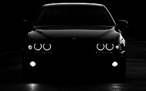 Black BMW E39 M5 Front View With Glowing Angel Eyes Headlights In Dark Setting HD wallpaper