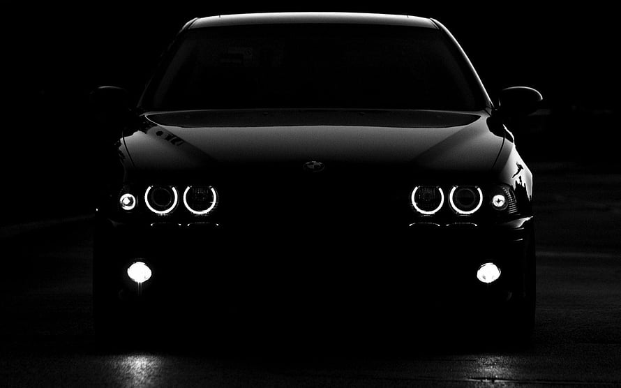 Black BMW E39 M5 Front View With Glowing Angel Eyes Headlights In Dark Setting HD wallpaper