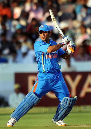 MS Dhoni in India Cricket Kit Executing a Powerful Batting Stroke on the Field HD phone wallpaper