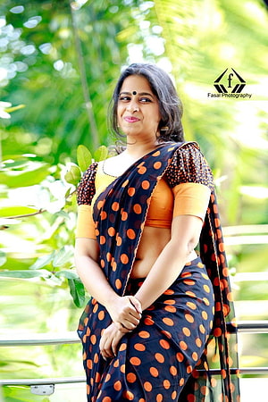 Sadhika Venugopal in a Polka Dot Saree with Yellow Blouse HD phone wallpaper