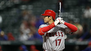 Shohei Ohtani in Los Angeles Angels uniform holding bat at the plate HD wallpaper