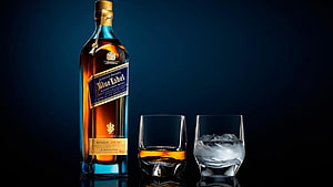 Johnnie Walker Blue Label Scotch Whiskey Bottle with Two Glasses and Ice on Dark Background HD wallpaper